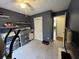 Multi-purpose bedroom offering ample storage, including a closet, shelves and dressers for organization at 2529 Feathertree Ln, Lawrenceville, GA 30044