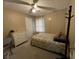 Inviting bedroom featuring a ceiling fan and neutral decor, creating a cozy and relaxing atmosphere at 2529 Feathertree Ln, Lawrenceville, GA 30044