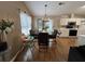 Dining area with modern lighting, wood floors, and access to the kitchen at 2529 Feathertree Ln, Lawrenceville, GA 30044