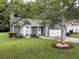 Charming home featuring a well-manicured front yard and a convenient attached one-car garage at 2529 Feathertree Ln, Lawrenceville, GA 30044