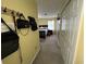 Hallway with storage offering ample storage, including a closet, shelves and dressers for organization at 2529 Feathertree Ln, Lawrenceville, GA 30044