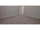 Spacious carpeted bedroom with a neutral color scheme and ample natural light at 488 Charleston Pl, Villa Rica, GA 30180