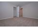 Bedroom featuring plush carpet and access to a closet and ensuite bathroom at 488 Charleston Pl, Villa Rica, GA 30180
