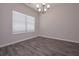 Well-lit dining room with neutral walls and hardwood floors, perfect for entertaining at 488 Charleston Pl, Villa Rica, GA 30180