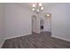 Dining room boasting hardwood floors and archways leading to other living spaces at 488 Charleston Pl, Villa Rica, GA 30180