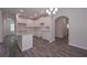 Spacious kitchen with granite countertops, white cabinets, and an open floor plan at 488 Charleston Pl, Villa Rica, GA 30180