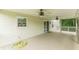 Covered back deck with ceiling fans and sliding glass doors, offering seamless indoor-outdoor flow at 9707 Squirrel Wood Run, Douglasville, GA 30135