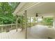 Expansive covered back deck with wood railings and ceiling fans for outdoor living at 9707 Squirrel Wood Run, Douglasville, GA 30135