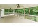 Large covered back deck with multiple ceiling fans, ideal for entertaining guests at 9707 Squirrel Wood Run, Douglasville, GA 30135