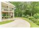 Expansive backyard featuring a patio, staircase, manicured lawn and access to a wooded area at 9707 Squirrel Wood Run, Douglasville, GA 30135