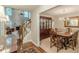 Elegant dining room with hardwood floors and a staircase leading to the living room at 9707 Squirrel Wood Run, Douglasville, GA 30135