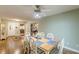 Dining room with a view of the front entry way, staircase, hardwood floors, and a light green wall at 9707 Squirrel Wood Run, Douglasville, GA 30135