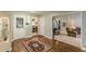 Inviting foyer features hardwood floors, natural light, and access to living room and dining area at 9707 Squirrel Wood Run, Douglasville, GA 30135