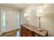 Welcoming foyer with hardwood floors and a stylish console table with lamps at 9707 Squirrel Wood Run, Douglasville, GA 30135
