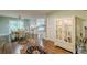 Open layout featuring hardwood floors, dining area, kitchen, and a view of the backyard at 9707 Squirrel Wood Run, Douglasville, GA 30135