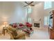 Inviting living room featuring a fireplace, high ceilings, and comfortable seating at 9707 Squirrel Wood Run, Douglasville, GA 30135