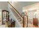 Staircase with chair lift providing access to the second floor at 9707 Squirrel Wood Run, Douglasville, GA 30135
