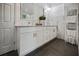 Bright bathroom with a double vanity, marble walls, tile floors, and modern fixtures at 1558 Line St, Decatur, GA 30032