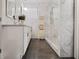 Contemporary bathroom with a double vanity, marble walls, and a glass-enclosed shower at 1558 Line St, Decatur, GA 30032