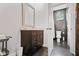 Well-lit bathroom with dark brown cabinets, marble countertop, and sleek fixtures at 1558 Line St, Decatur, GA 30032