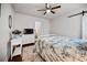Bright bedroom featuring a ceiling fan, wood floors, and white walls with modern decor at 1558 Line St, Decatur, GA 30032