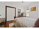Bedroom features wood floors, ceiling fan, closet and sunny window at 1558 Line St, Decatur, GA 30032