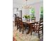 Elegant dining room with hardwood floors, a stylish rug, and a modern chandelier at 1558 Line St, Decatur, GA 30032