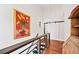 Hallway with wood floors, barn door, and artistic decor at 1558 Line St, Decatur, GA 30032