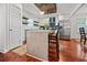 Open kitchen with an island, white cabinets, and stainless steel appliances at 1558 Line St, Decatur, GA 30032
