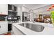 The kitchen boasts a gas range with a pot filler and dark subway tile backsplash at 1558 Line St, Decatur, GA 30032