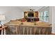 Living room features built-in cabinetry with a wine fridge and wood accent wall at 1558 Line St, Decatur, GA 30032