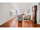 Bright and inviting living room featuring hardwood floors and an open staircase at 1558 Line St, Decatur, GA 30032
