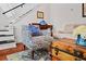 Inviting living room features stairs, hardwood floors, and stylish furnishings in a sunlit space at 1558 Line St, Decatur, GA 30032