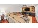 Living room features built-in cabinetry with a wine fridge and wood accent wall at 1558 Line St, Decatur, GA 30032