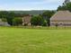 A spacious backyard with a black fence offers privacy and security at 1604 Falcon Ct, Locust Grove, GA 30248