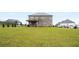 Spacious backyard featuring an extended lawn at 1604 Falcon Ct, Locust Grove, GA 30248