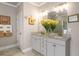 Stylish bathroom with granite counters, dual vanity, and tasteful decor at 1604 Falcon Ct, Locust Grove, GA 30248