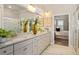 Beautiful bathroom featuring a double vanity with granite counters, tile floors and walk-in shower with glass door at 1604 Falcon Ct, Locust Grove, GA 30248