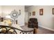 Relaxing bedroom featuring a daybed, an armchair, and carpet at 1604 Falcon Ct, Locust Grove, GA 30248