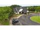 Exterior view of the clubhouse offering covered parking, manicured landscaping, and convenient accessibility features at 1604 Falcon Ct, Locust Grove, GA 30248