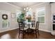 Cozy dining area with natural light, stylish lighting fixture and seating for four at 1604 Falcon Ct, Locust Grove, GA 30248