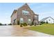 Beautiful brick home with a large driveway and well-maintained landscaping at 1604 Falcon Ct, Locust Grove, GA 30248