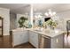 Open concept kitchen with a large island, granite counters, and modern fixtures at 1604 Falcon Ct, Locust Grove, GA 30248