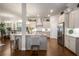 Open-concept kitchen features a center island, modern appliances, and seamless flow into the adjacent dining area at 1604 Falcon Ct, Locust Grove, GA 30248