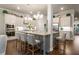 Bright kitchen with a center island, stainless steel appliances, and ample counter space at 1604 Falcon Ct, Locust Grove, GA 30248
