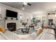 Comfortable living room features a fireplace, large windows, and stylish decor at 1604 Falcon Ct, Locust Grove, GA 30248
