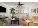 Comfortable living room with ceiling fan and cozy recliner chairs at 1604 Falcon Ct, Locust Grove, GA 30248