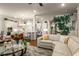 Open-concept living space seamlessly integrates the kitchen, living area, and dining space at 1604 Falcon Ct, Locust Grove, GA 30248