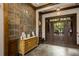 A well-lit lobby with a tiled floor, rich wood accents, and an information desk creating a welcoming atmosphere at 1604 Falcon Ct, Locust Grove, GA 30248