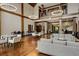 Elegant lounge area features high ceilings, stylish lighting, comfortable seating, and hardwood flooring at 1604 Falcon Ct, Locust Grove, GA 30248
